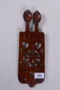A Welsh love spoon with pierced decoration, inscribed ES and MN, 1762, 30cm long