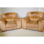 A pair of contemporary leather easy chairs