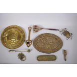 A collection of C19th and C20th brass items, including a pen tray, alms dishes, candle snuffer,