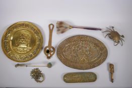 A collection of C19th and C20th brass items, including a pen tray, alms dishes, candle snuffer,