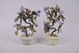A pair of Chinese ornamental hardstone trees, 23cm high