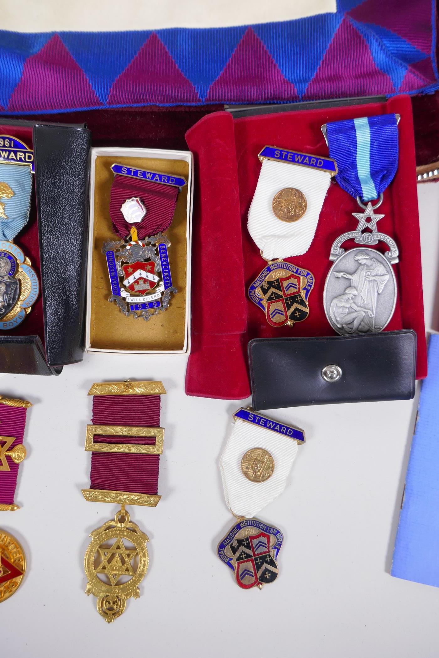 A collection of Masonic regalia to include an apron, sash, assorted medals (some silver) and a - Image 3 of 6