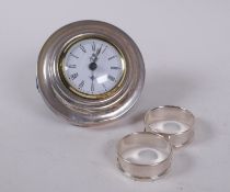 A hallmarked silver easel alarm clock, the dial with R.A.F. crest, 10cm diameter, late C20th, and