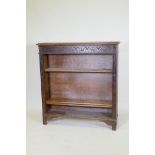 A C19th oak open bookcase with carved frieze, 107 x 25cm, 113cm high