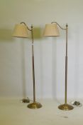 A pair of brass floor lamps with directional function, now AF, 146cm high