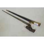 A British Army 1876 pattern socket bayonet in a leather scabbard with brass mounts, stamped WDE7