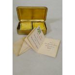 A WWI Christmas 1914 Princess Mary gift tin, with cigarettes and unopened tobacco, and greetings