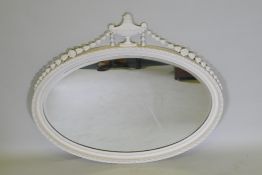 An Adam style oval wall mirror, with harebell and urn decoration, early C20th giltwood and