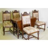 A c19th oak gateleg table with barley twist supports, and four oak dining chairs with carved and