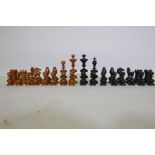 A C19th ebony and boxwood chess set, with fine turned and carved detail, king 11cm high