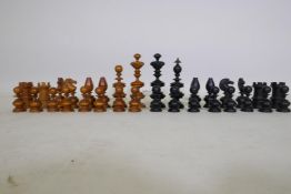 A C19th ebony and boxwood chess set, with fine turned and carved detail, king 11cm high