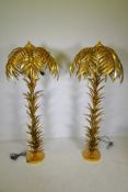 A pair of gilt metal floor lamps in the form of palm trees, 160cm high