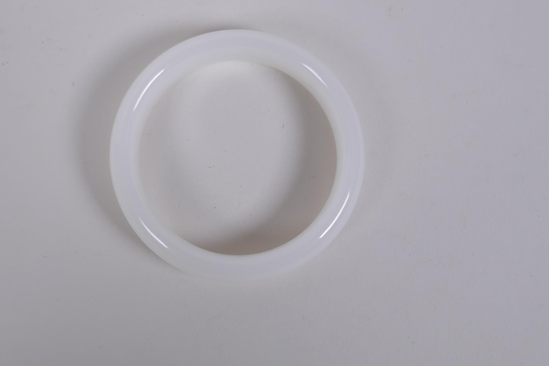 A white hardstone bangle, 8cm diameter - Image 2 of 2