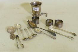 A silver Christening mug, AF, silver napkin rings, Georgian spoons, a pair of William Bateman