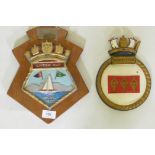 A Lipton Cup painted metal sailing trophy, mounted on a wood plaqye, 29cm high, and a ship's plaque,