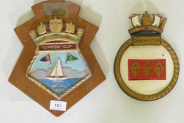 A Lipton Cup painted metal sailing trophy, mounted on a wood plaqye, 29cm high, and a ship's plaque,