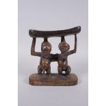 An African Luba tribe carved wood head rest, 18cm high