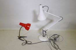 An industrial multi poseable desk lamp with a red enamel shade, together with a white angle poise