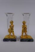 A pair of gilt bronze glass stem vases with figural decoration of a child, after Louis Kley, mounted