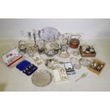 A large quantity of silver plate to include an Elkington teapot, candelabras, flatware, spirit