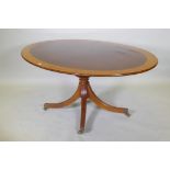 A Regency style inlaid mahogany breakfast table by William Tillman, with a tilt top, 170 x 118cm,
