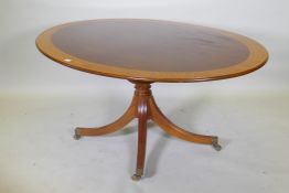 A Regency style inlaid mahogany breakfast table by William Tillman, with a tilt top, 170 x 118cm,