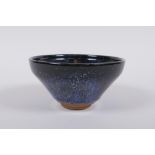 A Chinese Jian kiln treacle glaze bowl with flambe detail, 13cm diameter