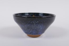 A Chinese Jian kiln treacle glaze bowl with flambe detail, 13cm diameter