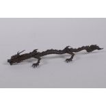 An oriental bronze figure of a five toed dragon, indistinct mark to base, 15cm long