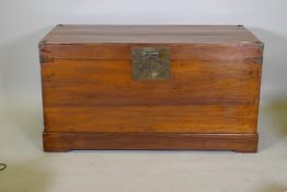 An oriental hardwood coffer with brass mounts, 126 x 60 x 66cm