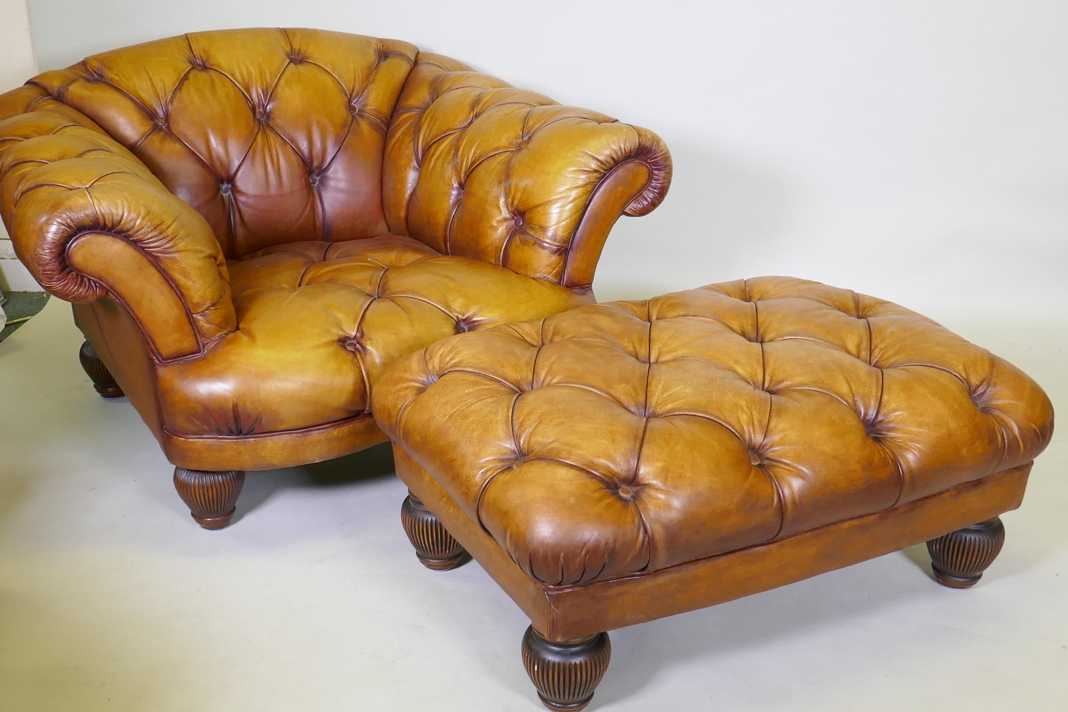 A Tetrad button leather easy chair and footstool