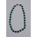 A malachite bead and seed pearl necklace with a 9ct gold clasp, 33cm long