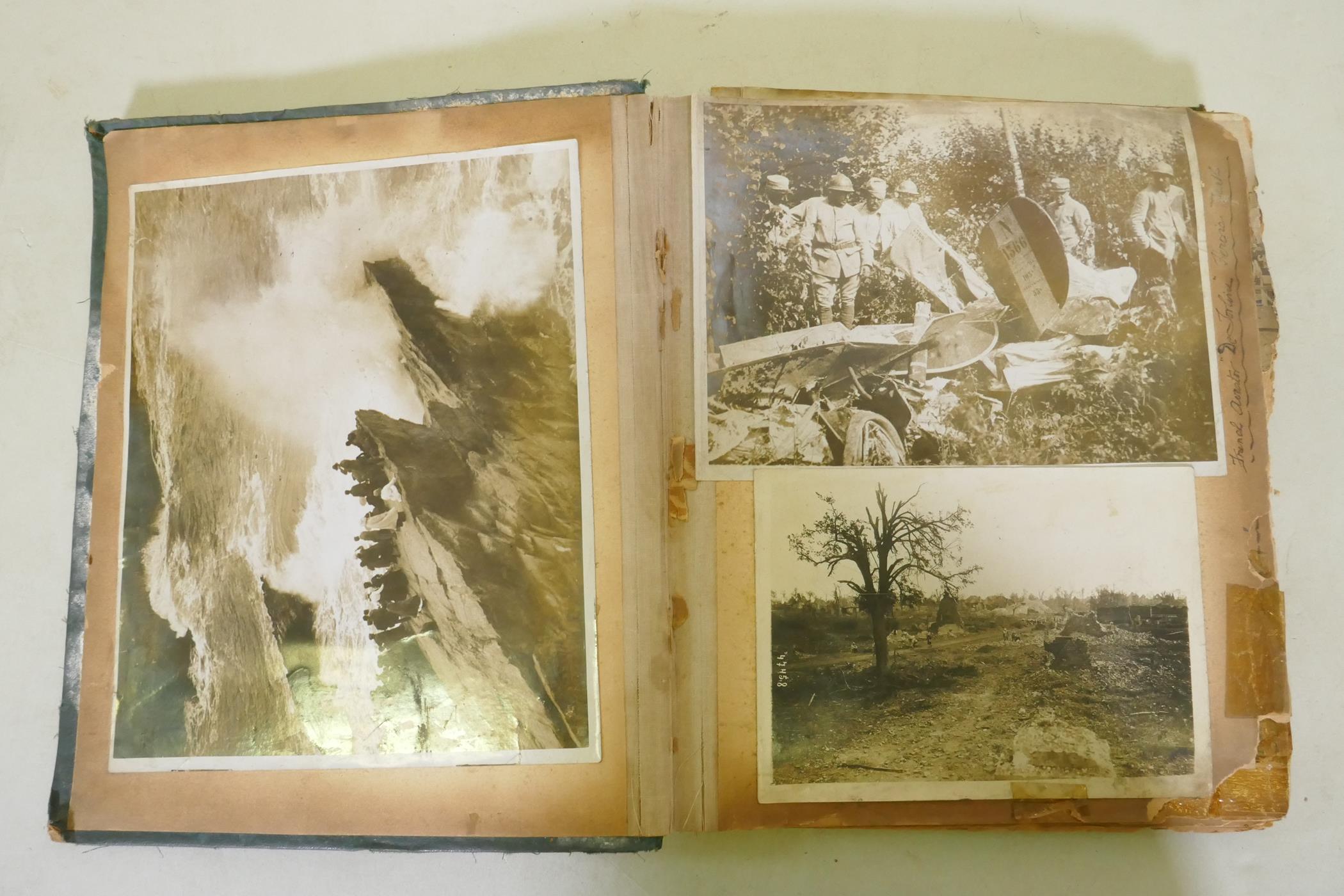 A scrap book of photographs from the Great War, images of the Western Front, artillery and trenches,