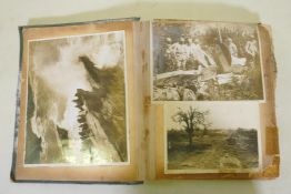 A scrap book of photographs from the Great War, images of the Western Front, artillery and trenches,