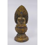 A Sino Tibetan gilt metal figure of Buddha seated on a lotus flower, 37cm high