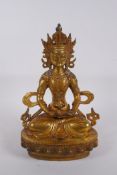 A Sino Tibetan gilt bronze Buddha seated holding a stupa, impressed double vajra mark to base,