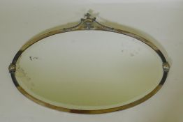 An antique Adam style silver plated oval wall mirror, 72 x 51cm