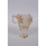 A Chinese moulded glass libation cup with kylin decoration, 10cm high