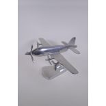 A decorative polished aluminium model of a plane with five propellers, 43cm wingspan