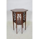 An Edwardian mahogany two tier occasional table with a hexagonal top an tapered legs, 52 x 46cm,