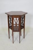 An Edwardian mahogany two tier occasional table with a hexagonal top an tapered legs, 52 x 46cm,