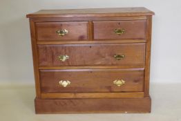 A Victorian walnut chest of two over two drawers, with moulded fronts and brass handles, raised on a