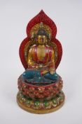 A Chinese cold painted filled bronze figure of Buddha seated on a lotus throne, 4 character mark