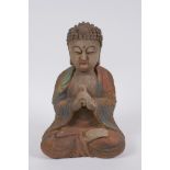 A Sino Tibetan carved and painted wood figure of Buddha, 22cm high