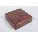 A Chinese copper box with repousse dragon and phoenix decoration, 8 x 8cm
