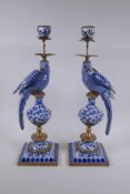 A pair of blue and white porcelain and gilt metal parrot candlesticks, 48cm high
