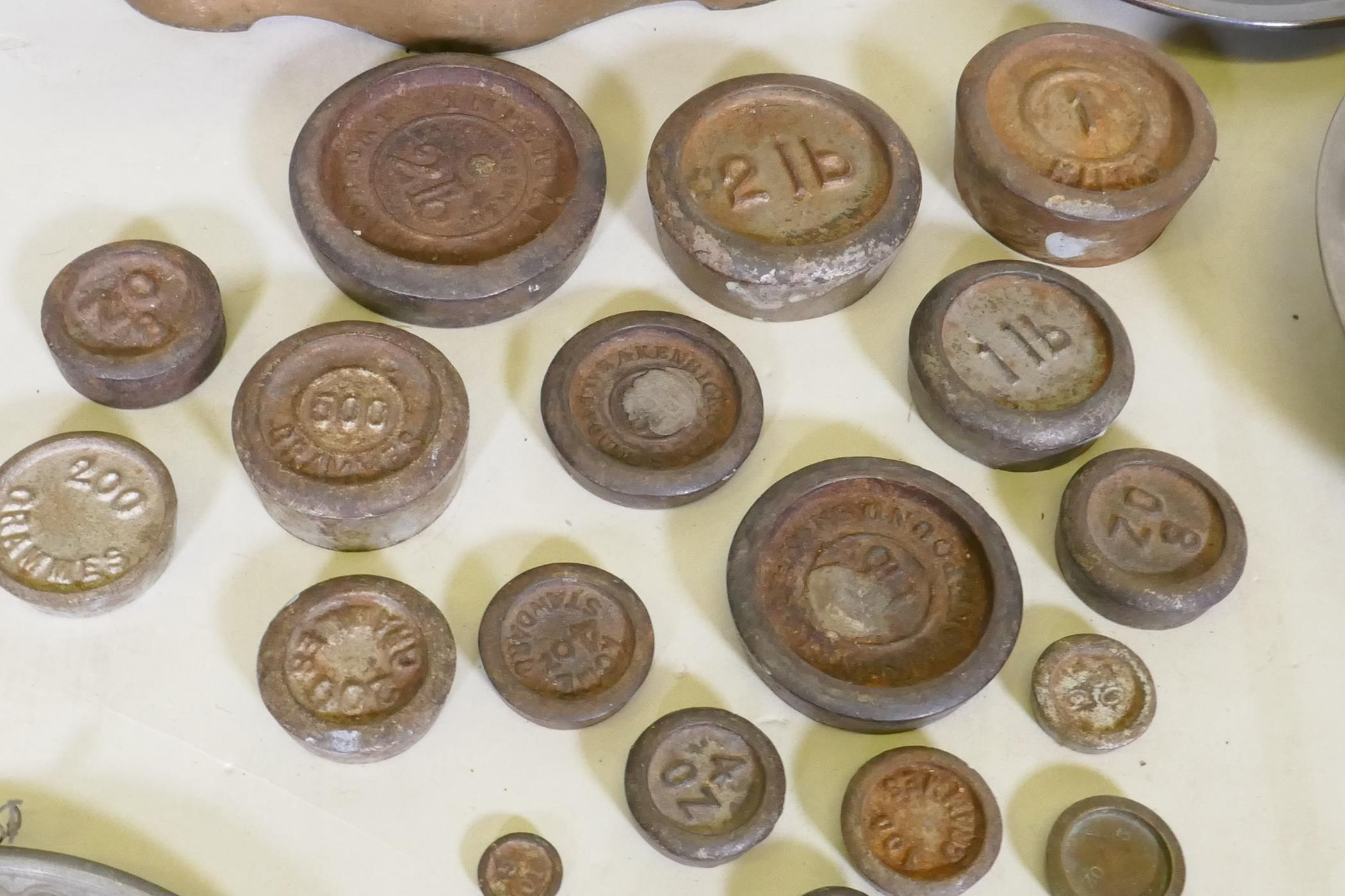 A set of antique weighing scales and weights, a pair of pewter plates with heraldic designs, a C19th - Image 4 of 5