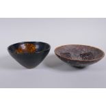 A Chinese Cizhou kiln conical bowl with leaf skeleton decoration and another with lotus flower