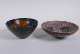 A Chinese Cizhou kiln conical bowl with leaf skeleton decoration and another with lotus flower