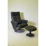 A Morris Furniture Group Relaxateeze leatherette tilt and swivel armchair and matching footstool